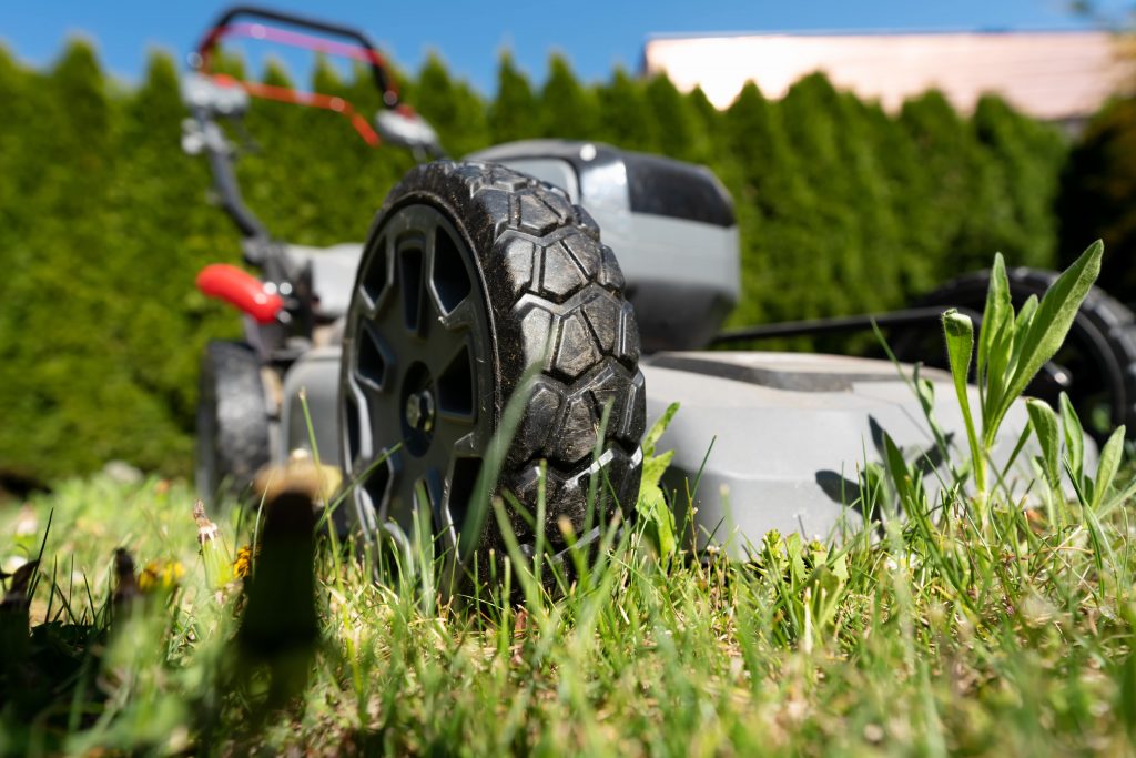 Close up of a cordless mower.