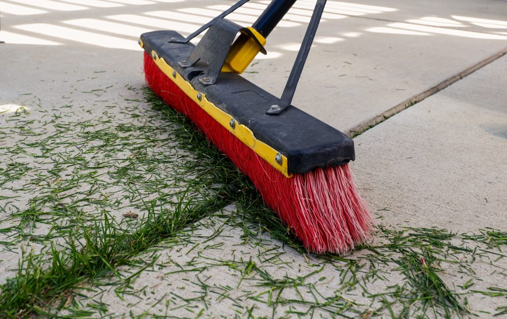 Grass clippings on a patio.