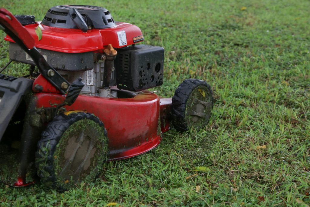 Lawn mower cutting wet grass.