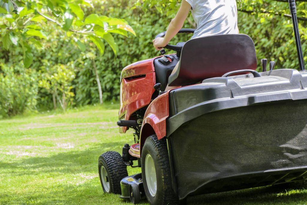 A ride on mower with a grass box.