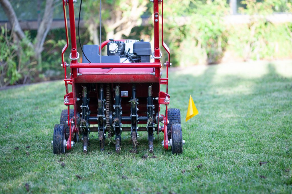 Powered hollow tine lawn aerator.