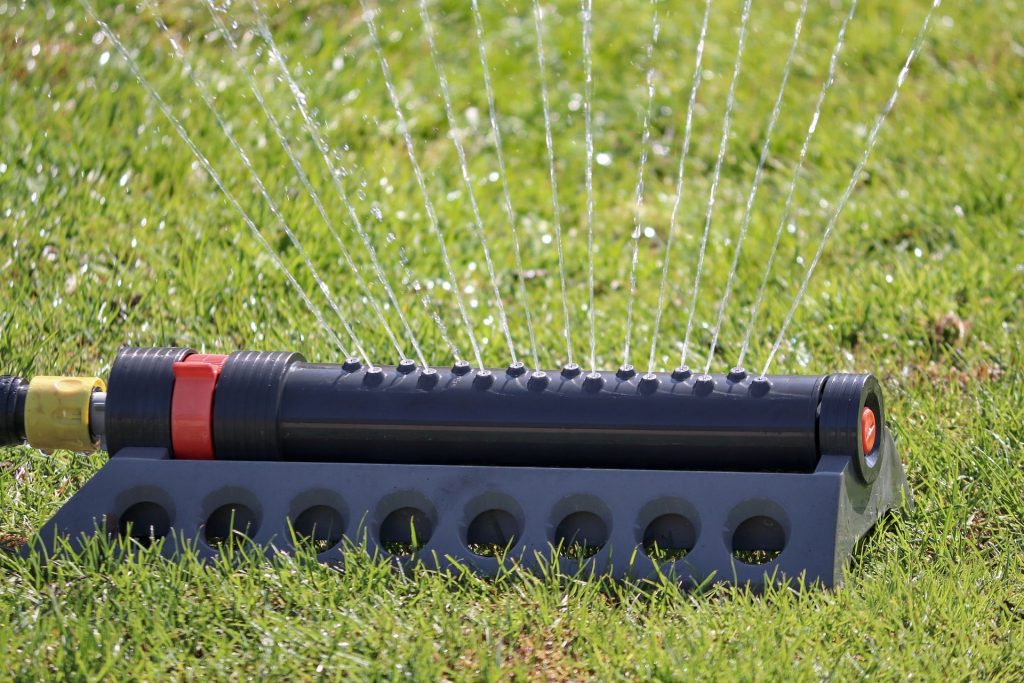 Sprinkler watering grass.