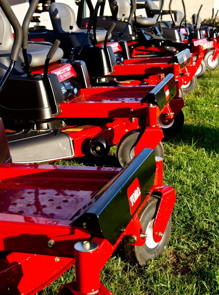 Number of petrol powered Toro ride-on lawn mowers.