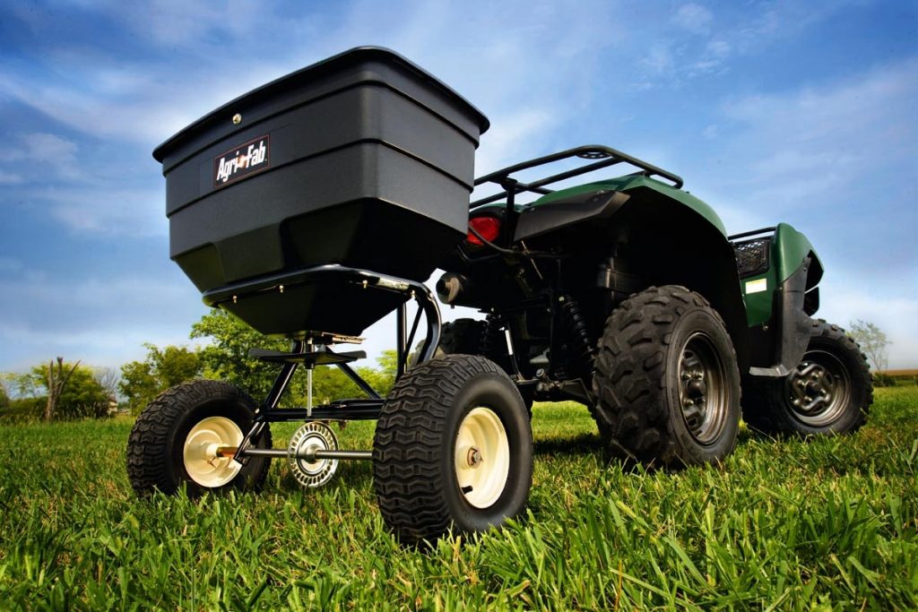 Tractor based rotary lawn spreader.