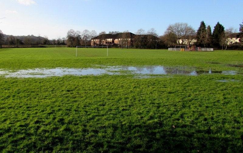 Large area of waterlogged grass.